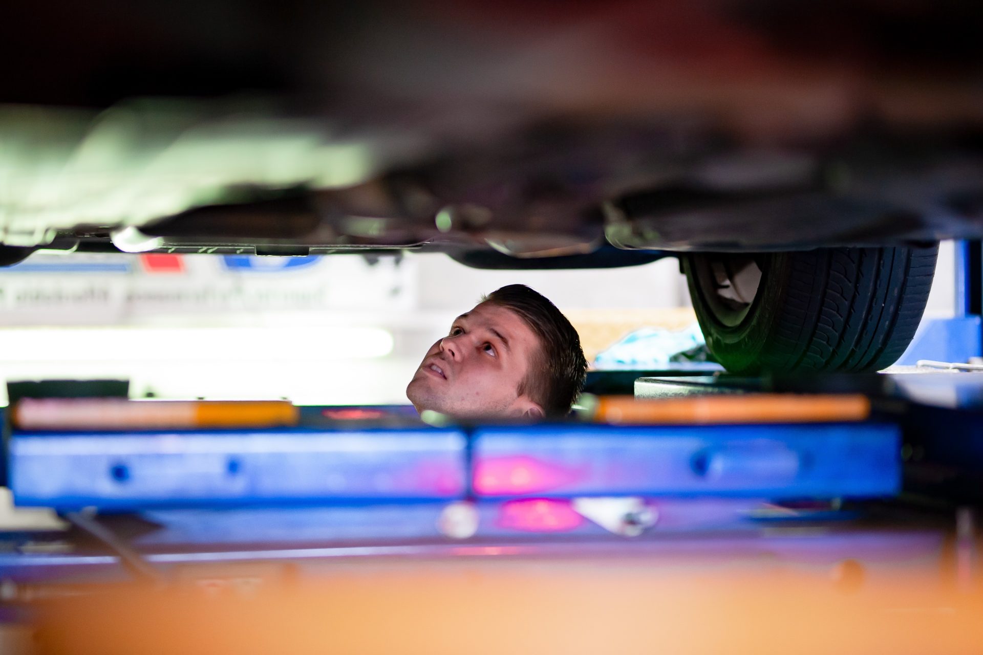 A mechanic inspecting a second-hand vehicle.