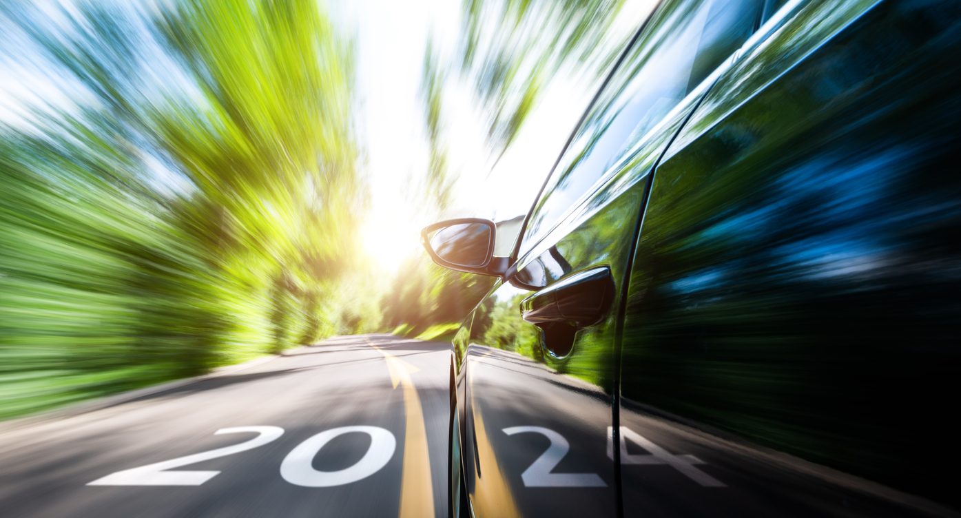 A European car driving down a road with the year 2020 in the background.